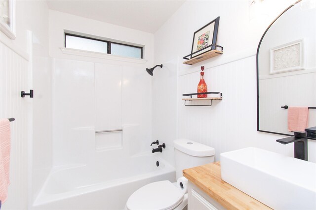 3918 Trinity Dr, Temple, TX 76504 - bathroom featuring toilet, shower / tub combination, vanity, and a wainscoted wall