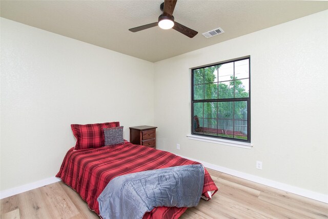 3918 Trinity Dr, Temple, TX 76504 - bedroom featuring light wood finished floors, baseboards, and ceiling fan
