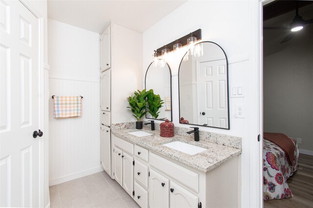 3918 Trinity Dr, Temple, TX 76504 - ensuite bathroom featuring double vanity and baseboards