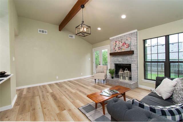 3918 Trinity Dr, Temple, TX 76504 - living area featuring light wood-style floors, a brick fireplace, baseboards, a chandelier, and recessed lighting