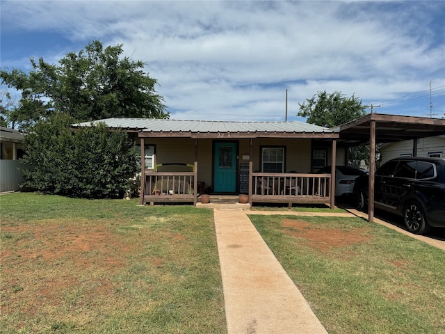 1206 S Crockett Dr, Abilene, TX 79605 - bungalow-style house with covered porch, a front yard, metal roof, and a carport