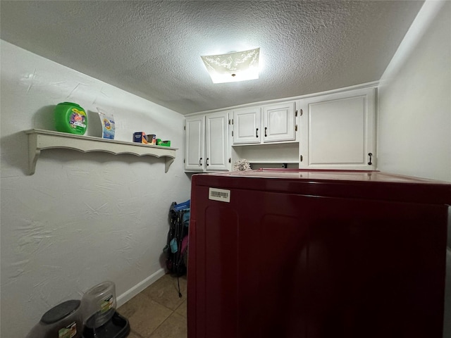 1206 S Crockett Dr, Abilene, TX 79605 - laundry area featuring a textured ceiling and baseboards