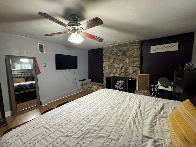 1206 S Crockett Dr, Abilene, TX 79605 - bedroom with wood finished floors, a ceiling fan, and baseboards