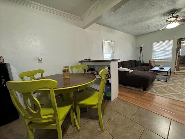 1206 S Crockett Dr, Abilene, TX 79605 - tiled dining area with a ceiling fan and ornamental molding