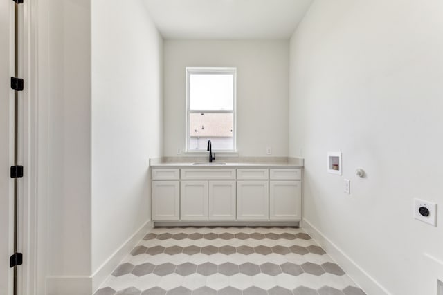 1324 Streetman Rd, Royse City, TX 75189 - washroom featuring hookup for an electric dryer, cabinet space, hookup for a washing machine, and baseboards