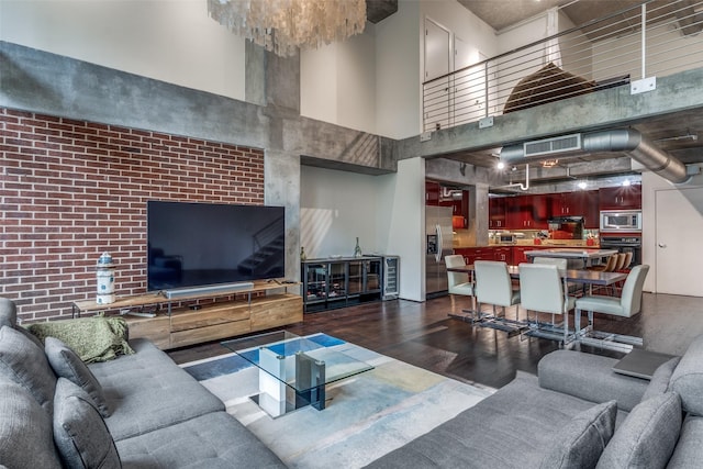 2011 Cedar Springs Rd Unit 106, Dallas, TX 75201 - living area featuring a high ceiling, wood finished floors, and stairs