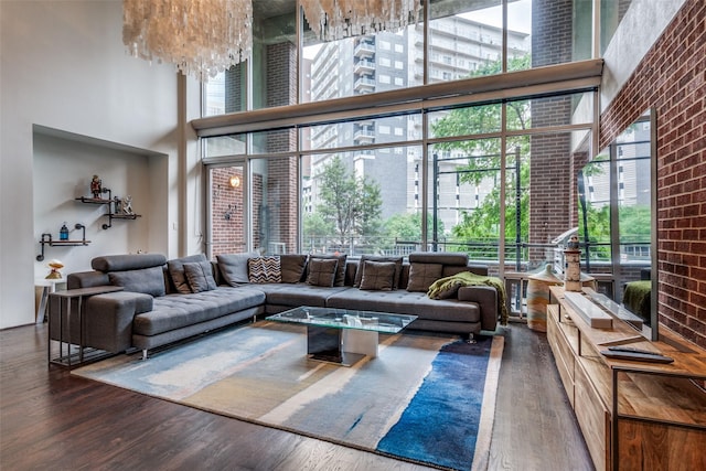 2011 Cedar Springs Rd Unit 106, Dallas, TX 75201 - living area featuring a towering ceiling and wood finished floors