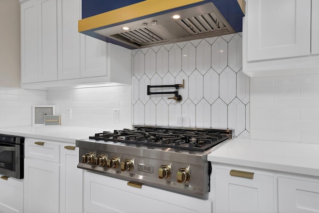 404 Bobbie St, Dallas, TX 75203 - kitchen featuring premium range hood, stainless steel gas stovetop, backsplash, and white cabinets