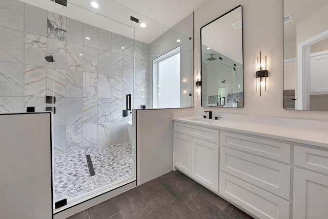 404 Bobbie St, Dallas, TX 75203 - bathroom with a shower stall, vanity, and recessed lighting