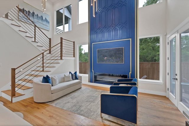 404 Bobbie St, Dallas, TX 75203 - living room with a high ceiling, wood finished floors, and stairs