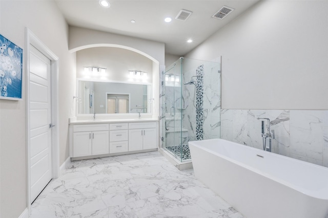 4220 Colton Dr, Carrollton, TX 75010 - full bathroom featuring a marble finish shower, marble finish floors, recessed lighting, a freestanding bath, and double vanity
