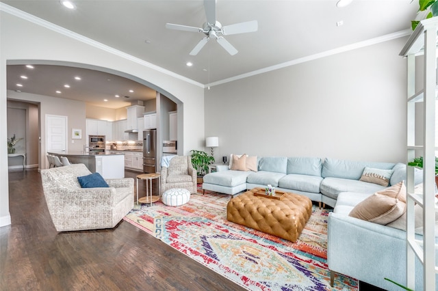 4220 Colton Dr, Carrollton, TX 75010 - living area with dark wood-style floors, arched walkways, ceiling fan, recessed lighting, and crown molding