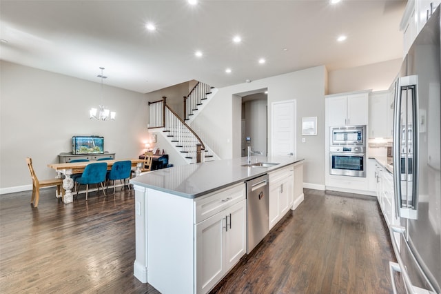 4220 Colton Dr, Carrollton, TX 75010 - kitchen featuring appliances with stainless steel finishes, a sink, recessed lighting, an island with sink, and white cabinetry