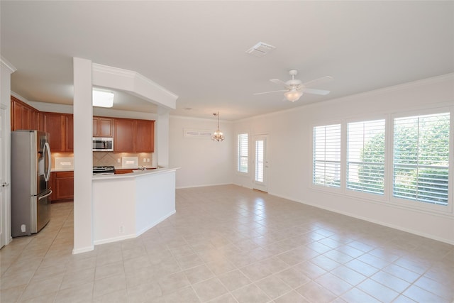 4001 Stone Oak Blvd, Denton, TX 76210 - kitchen featuring stainless steel appliances, a chandelier, ceiling fan, ornamental molding, and brown cabinets