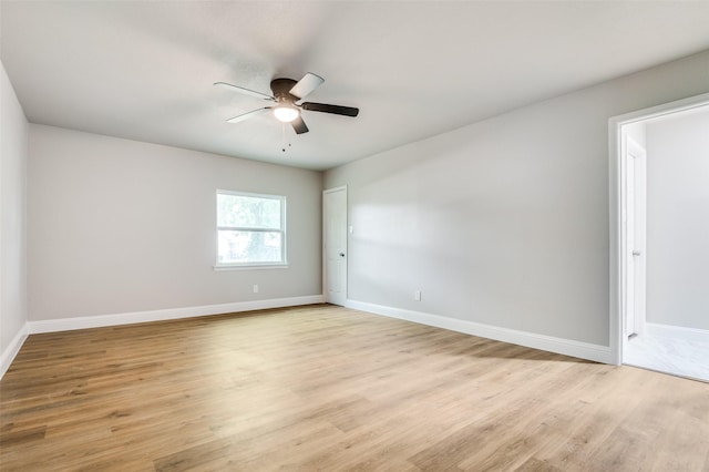 1326 Taperwicke Dr, Dallas, TX 75232 - spare room featuring a ceiling fan, light wood-style flooring, and baseboards