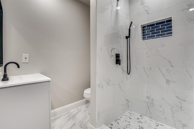 1326 Taperwicke Dr, Dallas, TX 75232 - bathroom with marble finish flooring, a tile shower, vanity, toilet, and baseboards