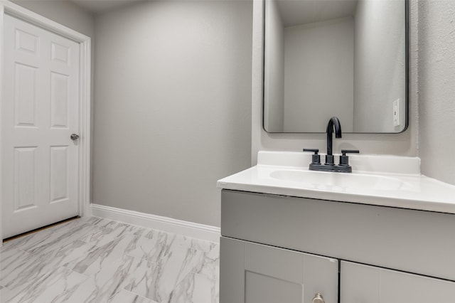 1326 Taperwicke Dr, Dallas, TX 75232 - bathroom featuring vanity, marble look tiles, and baseboards