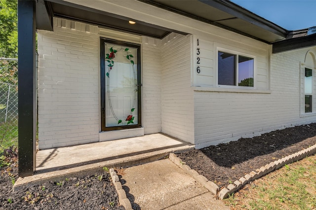 1326 Taperwicke Dr, Dallas, TX 75232 - doorway to property featuring brick siding