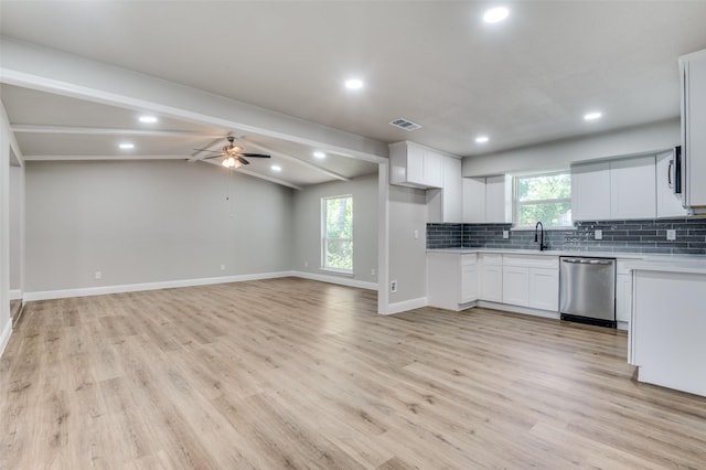 1326 Taperwicke Dr, Dallas, TX 75232 - kitchen featuring appliances with stainless steel finishes, light countertops, light wood-style flooring, backsplash, and ceiling fan