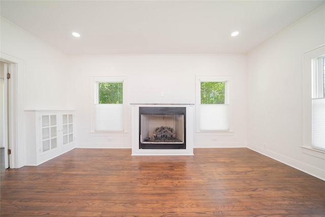 107 W Myrtle, Winnsboro, TX 75494 - unfurnished living room with a fireplace, ornamental molding, baseboards, wood finished floors, and recessed lighting
