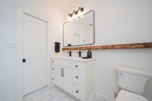 107 W Myrtle, Winnsboro, TX 75494 - bathroom with vanity, toilet, and tile patterned flooring