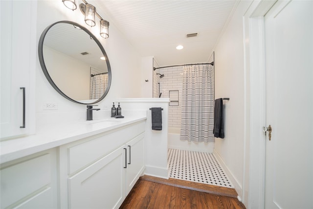107 W Myrtle, Winnsboro, TX 75494 - bathroom featuring a shower with shower curtain, vanity, wood finished floors, and recessed lighting