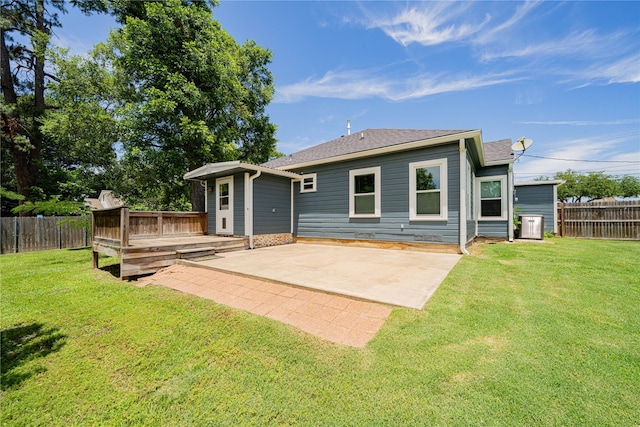 107 W Myrtle, Winnsboro, TX 75494 - back of house featuring cooling unit, a patio, a deck, and roof with shingles