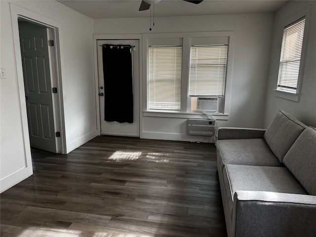 2958 Russell Ave, Abilene, TX 79605 - unfurnished living room with ceiling fan, baseboards, dark wood-style flooring, a wall unit AC, and cooling unit