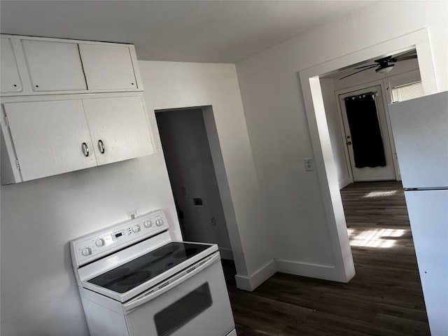 2958 Russell Ave, Abilene, TX 79605 - kitchen with white appliances, dark wood-style flooring, white cabinetry, and baseboards
