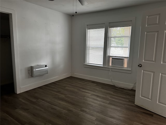 2958 Russell Ave, Abilene, TX 79605 - unfurnished bedroom featuring dark wood finished floors, cooling unit, and baseboards
