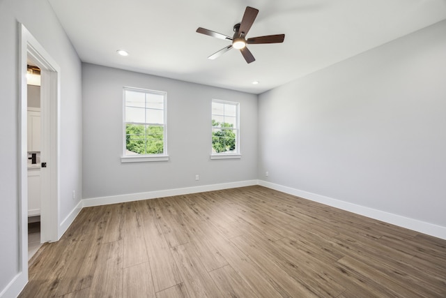 4002 Robert L Parish Sr Ave, Dallas, TX 75210 - spare room with wood finished floors, ceiling fan, baseboards, and recessed lighting