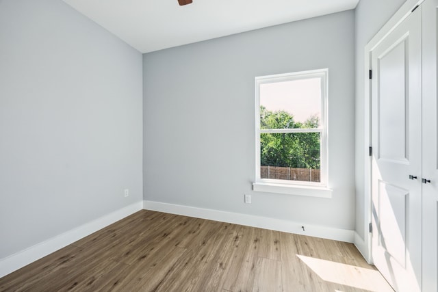 4002 Robert L Parish Sr Ave, Dallas, TX 75210 - unfurnished room featuring baseboards, wood finished floors, and ceiling fan