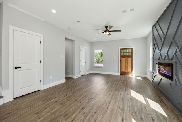 4002 Robert L Parish Sr Ave, Dallas, TX 75210 - unfurnished living room featuring a glass covered fireplace, a ceiling fan, dark wood finished floors, baseboards, and recessed lighting