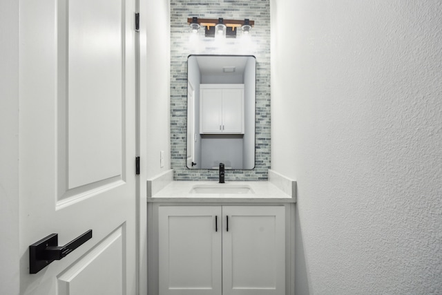 4002 Robert L Parish Sr Ave, Dallas, TX 75210 - bathroom featuring vanity, tasteful backsplash, and a textured wall