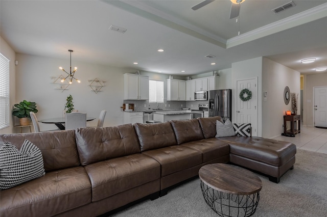 3125 Layla Creek Dr, Little Elm, TX 75068 - living area with a ceiling fan, a chandelier, crown molding, recessed lighting, and light colored carpet