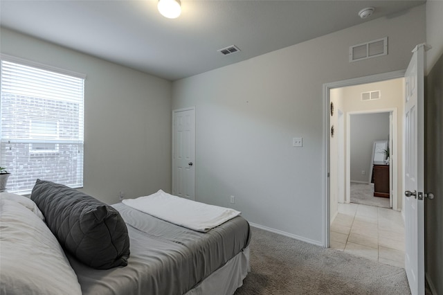 3125 Layla Creek Dr, Little Elm, TX 75068 - bedroom featuring light carpet, light tile patterned floors, and baseboards