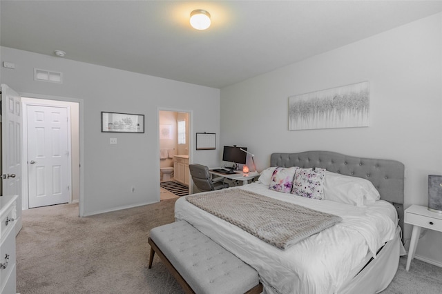 3125 Layla Creek Dr, Little Elm, TX 75068 - bedroom featuring light carpet, baseboards, and connected bathroom
