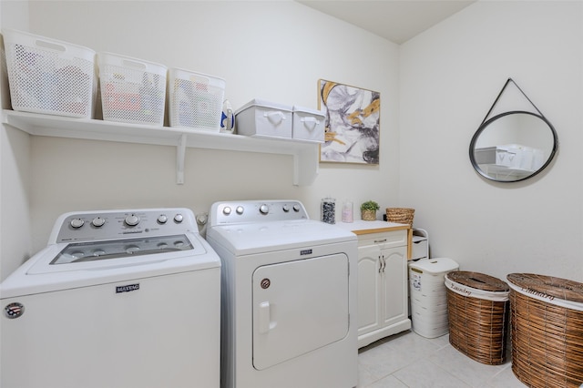 3125 Layla Creek Dr, Little Elm, TX 75068 - laundry area featuring independent washer and dryer, cabinet space, and light tile patterned flooring