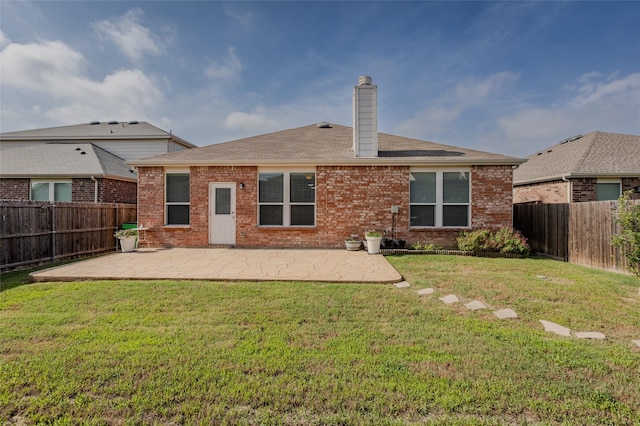3125 Layla Creek Dr, Little Elm, TX 75068 - rear view of property with a patio area, brick siding, a chimney, and roof with shingles