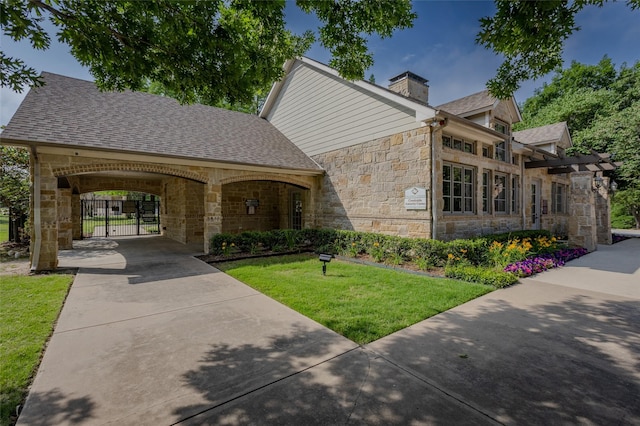 3125 Layla Creek Dr, Little Elm, TX 75068 - view of front facade with stone siding, a front lawn, a chimney, and a shingled roof