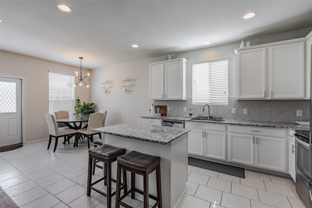 3125 Layla Creek Dr, Little Elm, TX 75068 - kitchen with a sink, stainless steel appliances, light tile patterned floors, tasteful backsplash, and recessed lighting