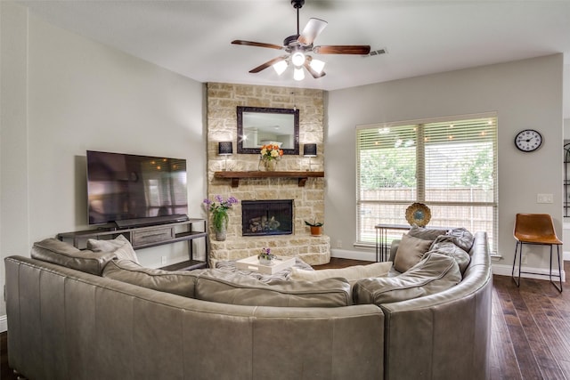 921 Yarwood Way, Burleson, TX 76028 - living area featuring a ceiling fan, baseboards, dark wood-type flooring, and a stone fireplace