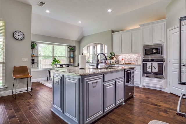 921 Yarwood Way, Burleson, TX 76028 - kitchen with appliances with stainless steel finishes, a sink, dark wood-type flooring, white cabinets, and light stone countertops