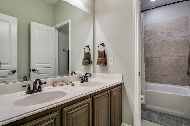 921 Yarwood Way, Burleson, TX 76028 - bathroom featuring toilet, double vanity, tub / shower combination, and a textured wall