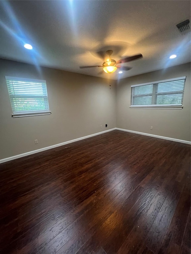 332 Belmont St, Hurst, TX 76053 - spare room with dark wood-style flooring, a ceiling fan, healthy amount of natural light, baseboards, and recessed lighting