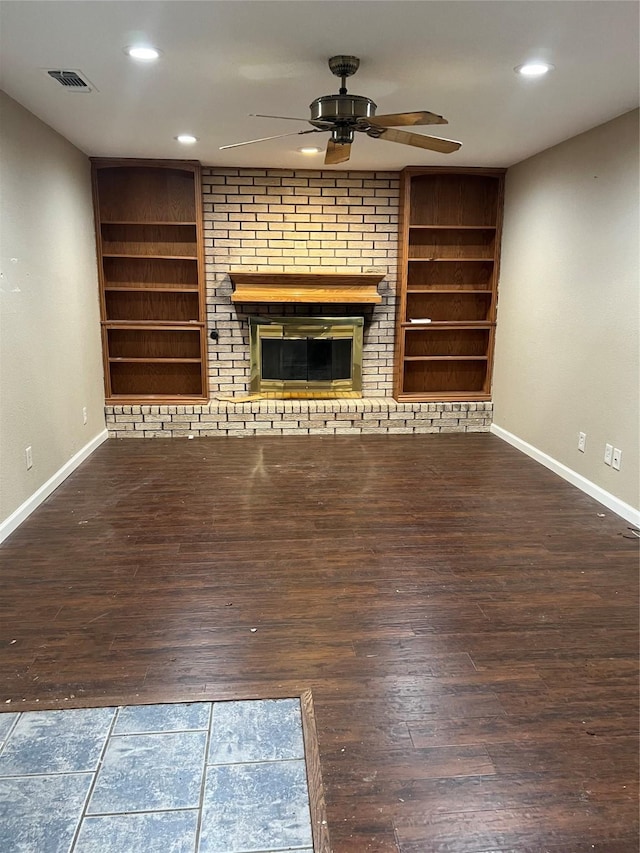 332 Belmont St, Hurst, TX 76053 - unfurnished living room with ceiling fan, baseboards, a brick fireplace, wood finished floors, and built in shelves