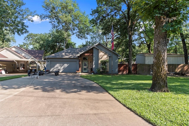 124 Robin Hood Way, Gun Barrel City, TX 75156 - mid-century modern home featuring driveway and an attached garage