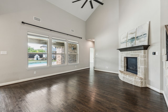 15505 City Garden Ln, Prosper, TX 75078 - unfurnished living room featuring ceiling fan, a fireplace, wood finished floors, high vaulted ceiling, and baseboards