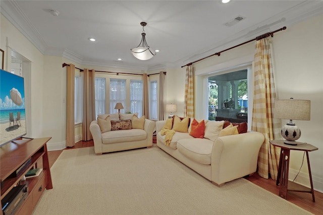 211 N Waddill St, Mckinney, TX 75069 - living room with wood finished floors, ornamental molding, recessed lighting, and baseboards
