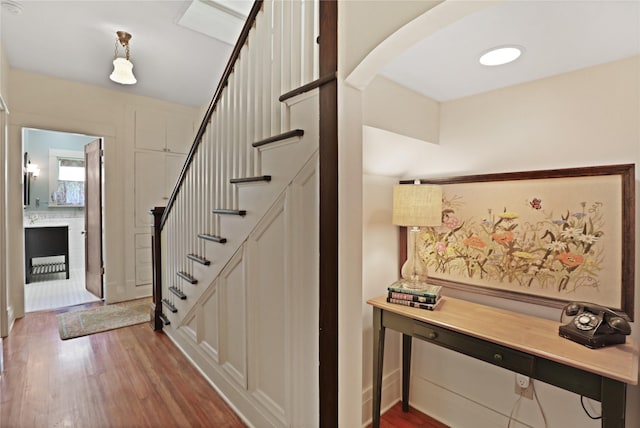 211 N Waddill St, Mckinney, TX 75069 - stairs featuring wood finished floors and arched walkways